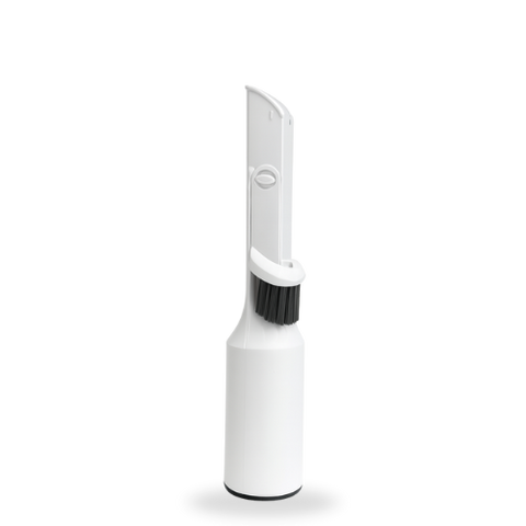 Witte handheld SmartPaw 2-in-1 platte borstelkop met zwarte haren en ronde handgreep op een witte achtergrond